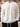 White notched collar top styled for relaxed everyday wear