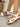 White open sandals with brown soles for women, side view