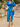 Woman wearing a blue floral summer dress 