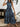 Woman wearing a blue patterned dress