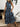 Woman wearing a blue sleeveless dress 