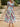 Woman wearing a colorful floral dress, outdoor