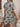Woman wearing a floral dress in a casual setting