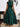 Woman wearing a green dress, back view