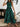 Woman wearing a green dress, front view