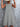 Woman wearing a light gray dress