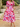 Woman wearing a pink and purple floral dress