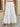 Woman wearing a white lace long skirt 