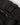Zipper and cargo pocket detail on matte black utility joggers